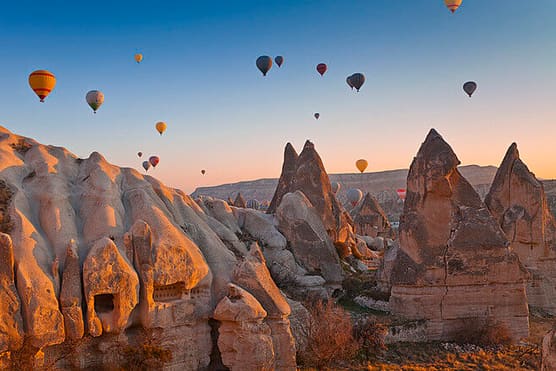 Hot-air balloons over the valleys of Göreme at dawn